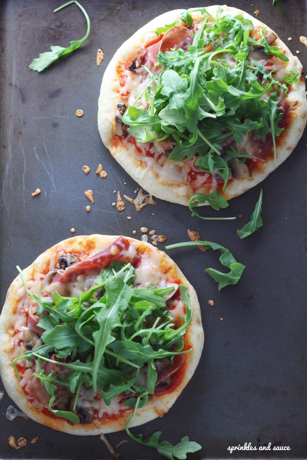 Pita Pizza with Prosciutto, Mushrooms and Arugula - sprinkles and sauce